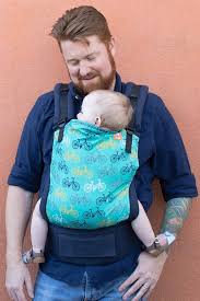Bike Baby Carrier Round And Round Tula Baby Carrier Head Out For A Stroll In An Adorable Tula Ba Ergonomic Baby Carrier Bike Baby Carrier Tula Baby Carrier