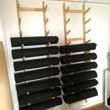 Its popularity is widespread across the world. Plywood Yoga Mat Storage At The Kali Collective Yoga Studio Made By Altronica Yoga Mat Storage Yoga Room Design Yoga Studio Design