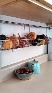 Related searches for hanging kitchen storage: 20 Ways To Squeeze A Little Extra Storage Out Of A Small Kitchen Small Kitchen Storage Kitchen Hacks Organization Rental Kitchen