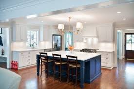 Gorgeous Bright Kitchen With A Dark Blue Island Great Color Blue Kitchen Island Custom Kitchen Island Kitchen Island Cabinets