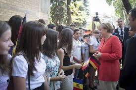 German chancellor angela merkel broke her silence thursday over german allegations that us intelligence agencies tapped her cell phone. In Front Of The Residence Of The Prime Minister Angela Merkel Was Greeted By Young People Waving German And Moldovan Flags