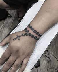 The 115 best rosary tattoos for men improb. Rosary Bead Tattoo Ideas Designs And Meanings Tatring