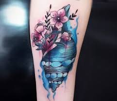 There are many beautiful ways to design these seashell tattoos. Conchshell Tags Tattoo Ideas World Tattoo Gallery