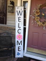 After you're finished sanding use a cloth to remove any dust. Welcome Sign Front Porch With Flower And Butterflies Door Signs Diy Pallet Projects Signs Porch Signs