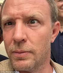 Jacqui Ainsley and Guy Ritchie kiss in wedding photo at Ashcombe House