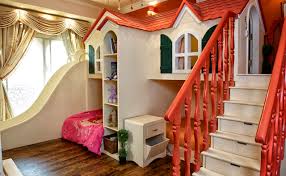 A chandelier, a frilly dollhouse and a colorful quilt add feminine touches to the fun space. Fantasy Kids Rooms
