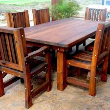 Here is a trendy designed outdoor patio table with a hole for your umbrella. Redwood Patio Table Custom Made Redwood Dining Tables