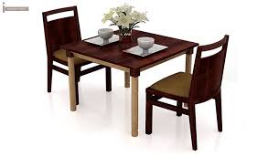However, as per the new age furniture designs, one also gets tables with chairs, benches and a combination of chair and benches. Buy Adriel 2 Seater Dining Set Mahogany Finish Online In India Wooden Street Dinning Table Set Dining Table Setting Dining Set