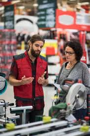 Hardware engineers work on computer hardware, so they use to contact them, one can fill out a form online at total tools, or use their store locator feature to get the phone number of a local branch. Salesman Discussing With Couple By Shelves At Hardware Store Masf02174 Maskot Westend61