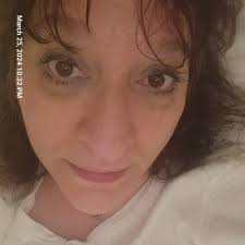 The photo shows two people. A man and a woman standing side by side. The  photo is a still from a popular TV show called The Dating Game, which aired  in the