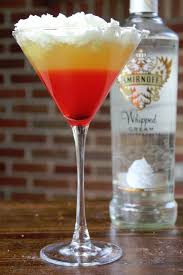 Perfect For Your Halloween Party Check Out This Candy Corn Cocktail This Recipe Is Super Whipped Cream Vodka Halloween Candy Corn Halloween Cocktail Recipes