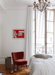 Parisian apartment white bedroom with black clothes storage. 10 Tips To Create A Chic And Refined Parisian Bedroom