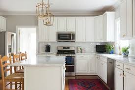 And we love seeing the different ways people are making their kitchens stand out. White Kitchen With Gold And Black Novocom Top