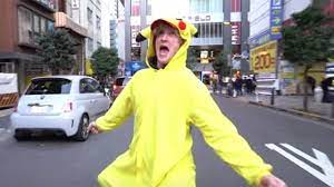 Logan paul holding his recently purchased charizard card. Logan Paul Ends Up In Hospital After Pokemon Joke Goes Wrong