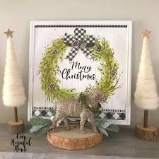 Make a beautiful lighted picture out of dollar tree gift bags! Our Hopeful Home Dollar Tree Merry Christmas Gift Bag Wall Art Update