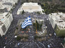 National flag consisting of a red field with a golden central disk and golden rays extending to the flag edges. Greeks Rally In Athens To Protest Use Of The Name Macedonia Arab News