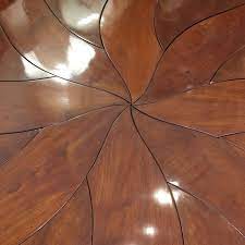 Leaves go around the outside of these tables and keep the shape round. L Rossi Expanding Round Dining Table Design Plus Gallery