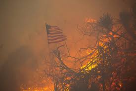 Thousands flee as wildfires burn out of ...