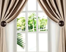 Medallion holdbacks are a stylish way to keep the curtains open. Medallion Holdback Etsy
