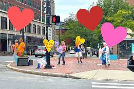 What's With the Signs, Dancing at Congress Square in Portland?