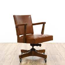 this mid century office chair is featured in a solid wood with a rustic walnut finish this desk chair has a rolling wood desk chair furniture white desk chair