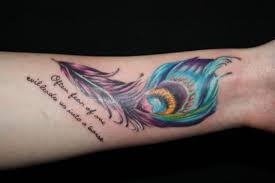 The lust of the goat is the bounty of god. Amazing Vivid Colored Peacock Feather With Quote Tattoo On Arm Tattooimages Biz
