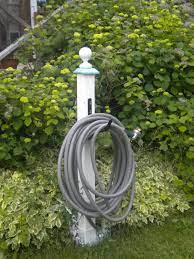 Diy Garden Hose Hanger With 4 X 4 Painted Wood Finial Hardware Store Hose Holder Garden Hose Hanger Hose Holder Diy Garden