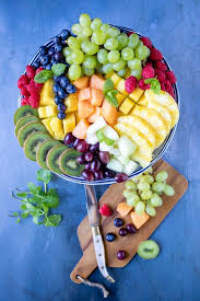 Create an outline of a tree shape using the grapes on a cutting board or serving platter. How To Make A Fruit Platter Fruit Tray Veggie Desserts