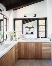 Alyssa kapito designed this gorgeous dark wood kitchen with white marble countertops and a herringbone tile marble backsplash. White Marble Counter Photos Design Ideas Remodel And Decor Lonny