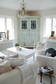 Despite The Rather Luxurious Chandelier This Room Retains A Very Cozy Country Charm Ch Shabby Chic Living Room Design Farm House Living Room Chic Living Room