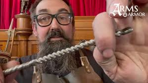 Forging medieval writhed sword guards