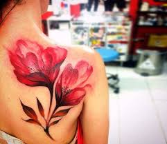 Watercolor lily tattoos can be part of bigger, meaningful tattoos, but also look amazing when tattooed in small sizes on hands, wrists or feet. Red Flowers Tattoo By Phellipe Rodrigues Post 25092