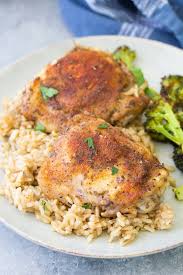 In This Easy Baked Chicken And Rice Casserole Tender Chicken Thighs And Rice C Healthy Casserole Recipes Chicken Thigh Casserole Chicken Thigh And Rice Recipe