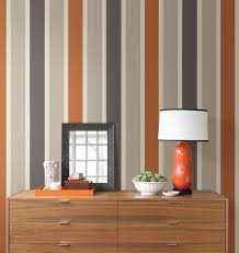 A Striped Wall Feature Wall With A Mod Orange And Grey Wallpaper Striped Wallpaper Striped Walls Home Wallpaper