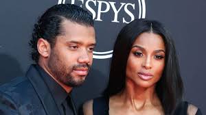 Russell Wilson caresses Ciara's leg in steamy photo