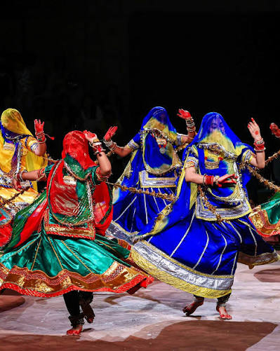 Members of the Gujarati Siddi tribe perform during a 'Siddi Dhamal' performance at Lok Rang 2025, in Jaipur