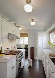 Gorgeous Galley Kitchen Marble Countertops Shelves Above Window Paint Color Schoolhouse Galley Kitchen Design Small Kitchen Lighting White Shaker Kitchen