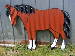 Designed in a prancing stance, this horse decoration is constructed of strong braided acrylic mesh that is sprinkled with glitter and wrapped… Corrugated Horse Handpainted Junk Metal Art Sheet Metal Crafts Metal Horse Sculptures