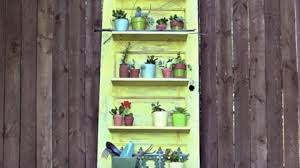 The door fitted on the wall and by fixing a shelf and pipe to hang. Old Distressed Door Plant Shelf Holder So Clever