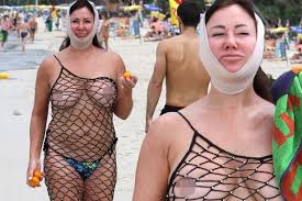 Lisa Appleton bares NIPPLES in bizarre see-through net dress after ...