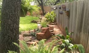 Backyard Landscaping With Boulders Shade Plants And A Walking Path For The Kids And The Dog Yelp Landscaping With Boulders Backyard Shade Shade Plants