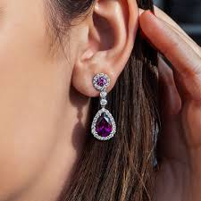 Check out our purple and gold earrings selection for the very best in unique or custom, handmade pieces from our earrings shops. Purple Garnet Earrings Wixon Jewelers
