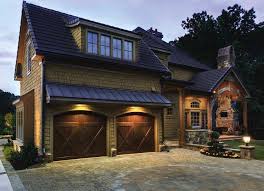 7 Features To Look For In Your Next Garage Door Carriage Style Garage Doors Barn Style Garage Doors Garage Door Design