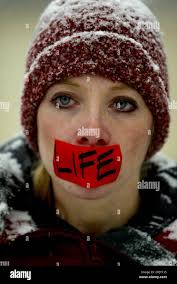 Pro-Life activist Heather Pollard fights the cold to stage a silent protest  at the Supreme Court