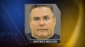 Police officer accused of slashing dog's throat after it bit woman