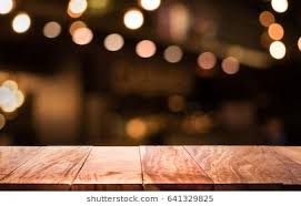 Wood Table Top With Blur Light Bokeh In Dark Night Cafe Restaurant Background Lifestyle And Celebration Concepts Blurred Lights Wood Table Top Wood Table