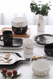 Black And White Plates And Bowls Give Your Dinnerware A Matching Marble Makeover Impress Your Friends With This Sleek In 2020 Ceramic Dinnerware Set Gold Kitchen Accessories Black And Copper Kitchen