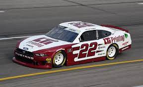 While at the penske shop several of us had this same view as this picture and i was explaining to a woman next to me about the red circles in the back window and how they adjusted the car through these openings. Team Penske Official Web Site