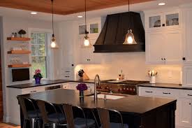 Curved hood the striking design of this curved wood range exhaust hood makes it a standout in any kitchen design. Kitchen With White Cabinets With Black Range Hood Transitional Kitchen Boston By Columbia Cabinets Houzz