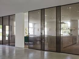 Aladin Sliding Doors Designed By Piero Lissoni In The Avenue Road Showroom Toronto Dark Brown Anodised Alumi Divider Design Interior Architecture Design